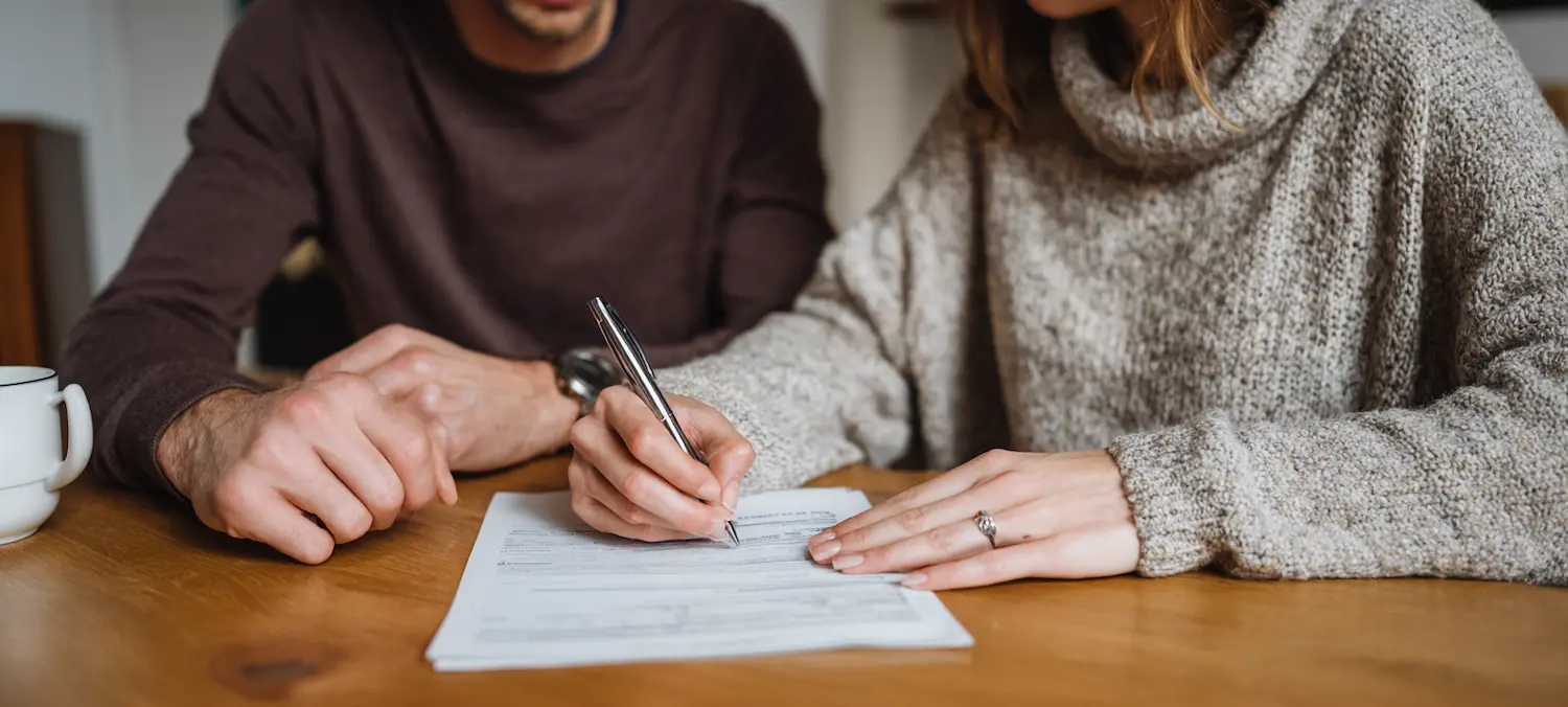 an albuquerque couple signs insurance papers