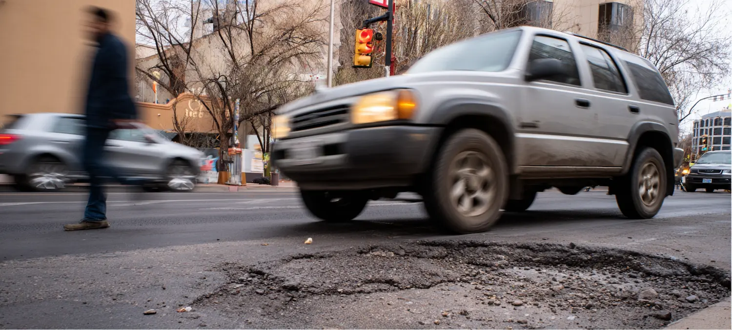 a city could be responsible as a car drives over a deep pothole
