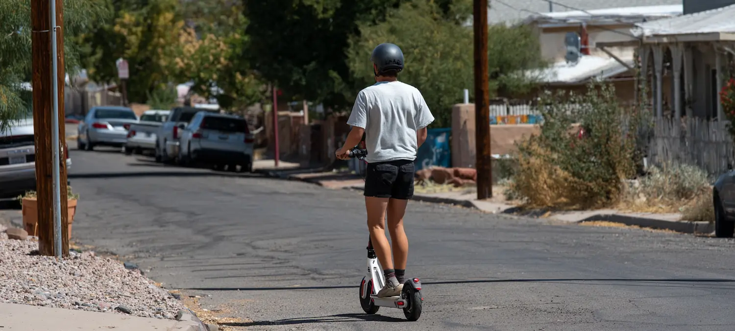 a new mexico e-scooter rider is at risk of being hit by a car