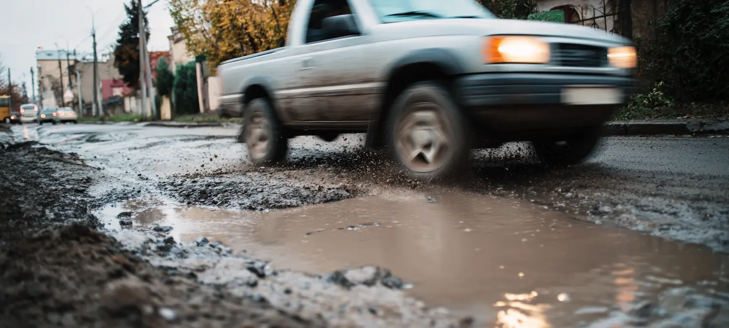 a truck drives over an albuquerque pothole is the city liable